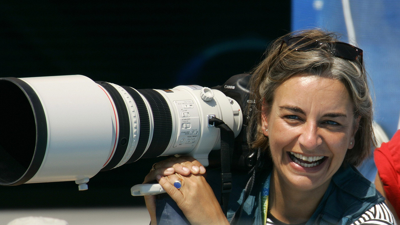 AP photographer Anja Niedringhaus laughs as she attends a swimming event at the 2004 Olympic Games in Athens