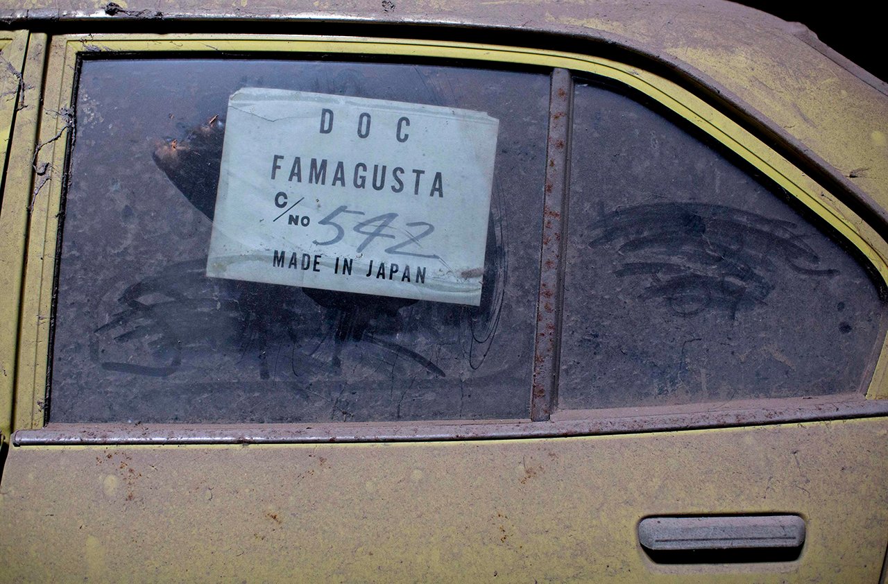 An import sticker is seen on the window of a car in the United Nations buffer zone in central Nicosia