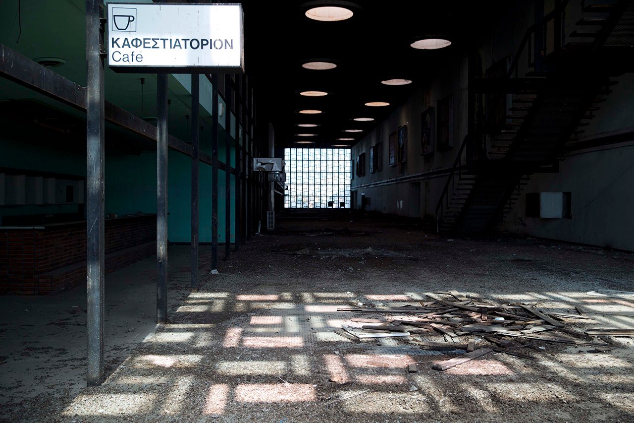 A cafe sign is seen at the abandoned Nicosia International Airport near Nicosia