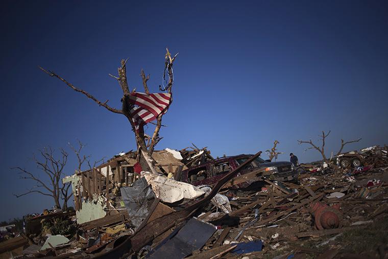 The United States flag is caught in a tree in Moore, Oklahoma, two days after the Oklahoma City suburb was left devastated by a tornado
