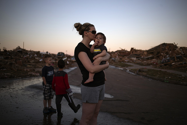 Rae Kittrell holds her son Rylan, who turned one-year-old today, a block away from her house in Moore, Oklahoma, two days after the Oklahoma City suburb was left devastated by a tornado