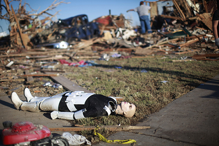 A Star Wars movie character mannequin lies outside a tornado destroyed house in Oklahoma City