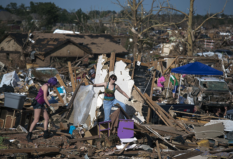 Residents salvage their belongings from their flattened home in Moore, Oklahoma, two days after the Oklahoma City suburb was left devastated by a tornado