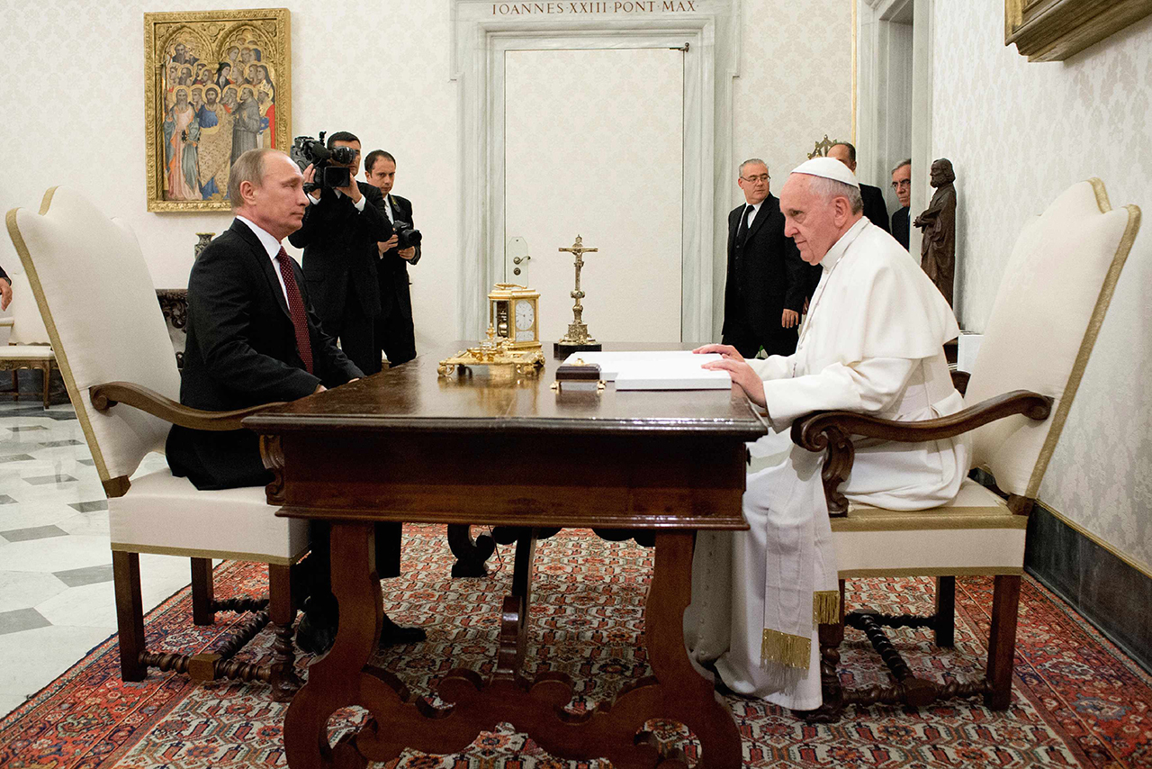 Pope Francis meets with Russia's President Vladimir Putin during a private audience at the Vatican