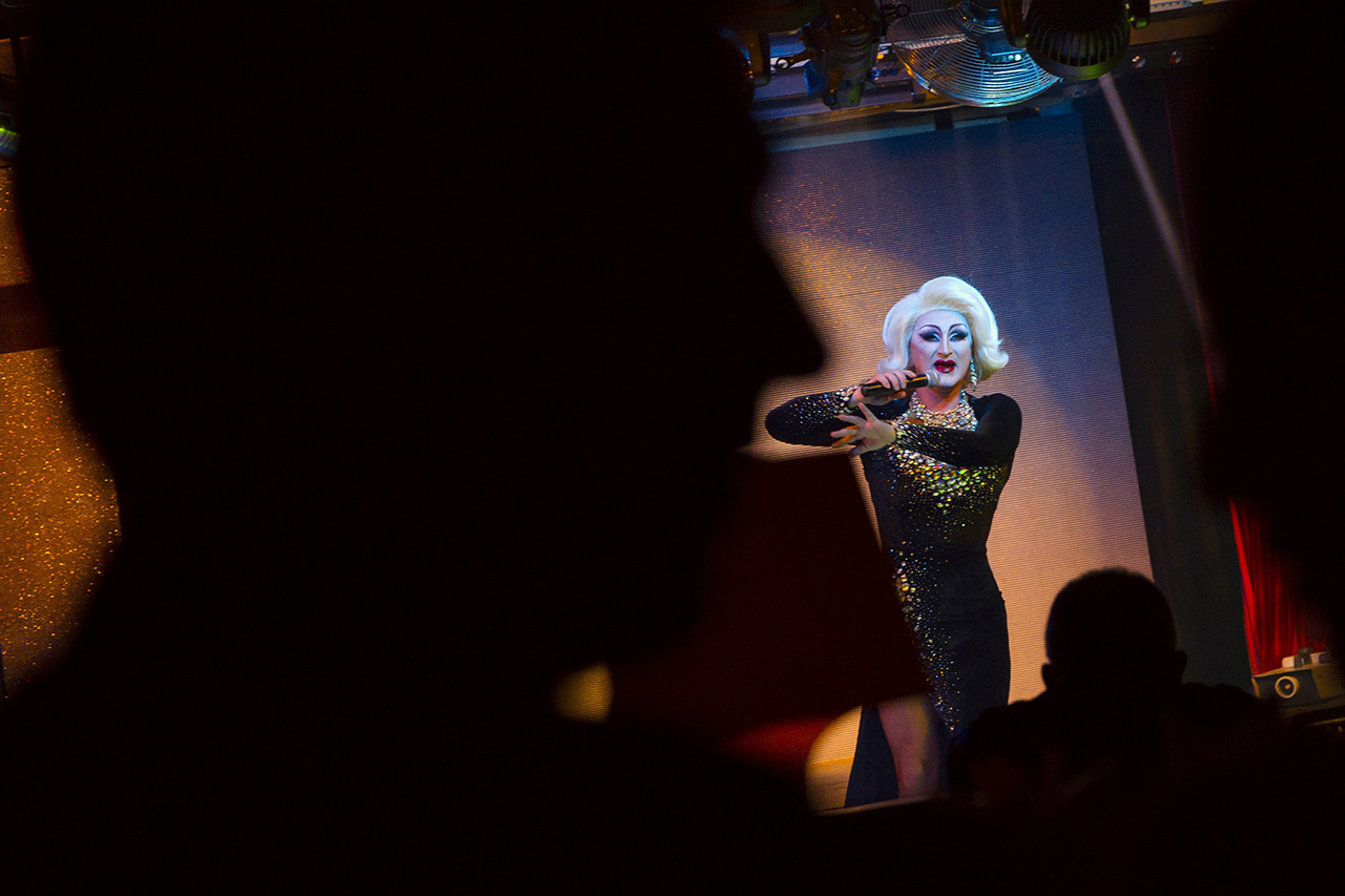 People watch as a drag queen takes part in a performance at Mayak, a gay cabaret club in Sochi